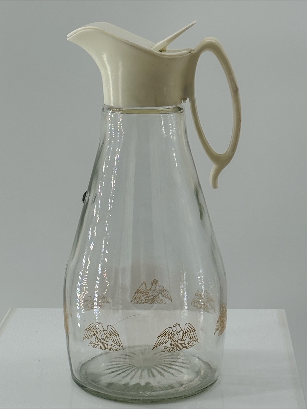Glass Beverage Pitcher with Cream Lid and Gold Eagle Design